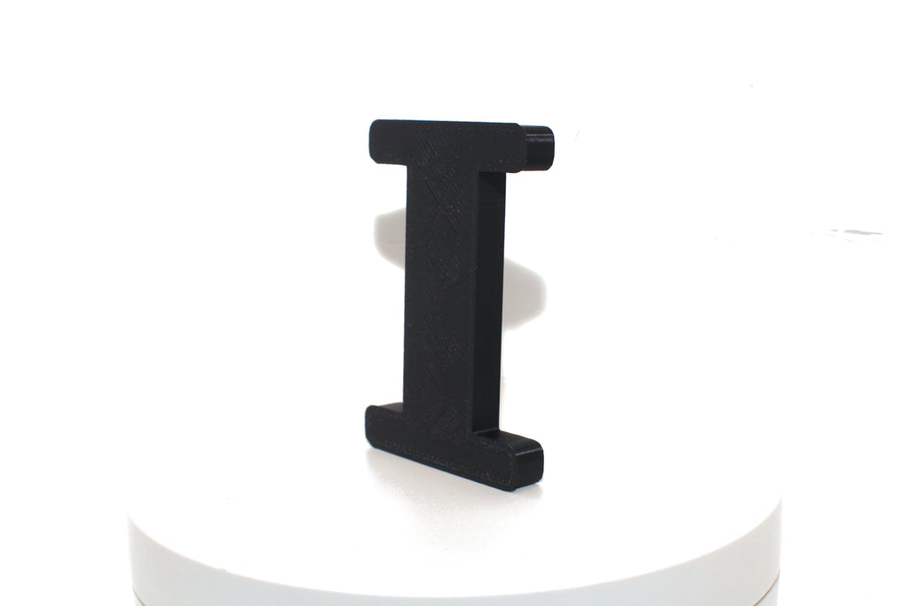 Black Eye large prop, matte black finish, angled view on a white platform.