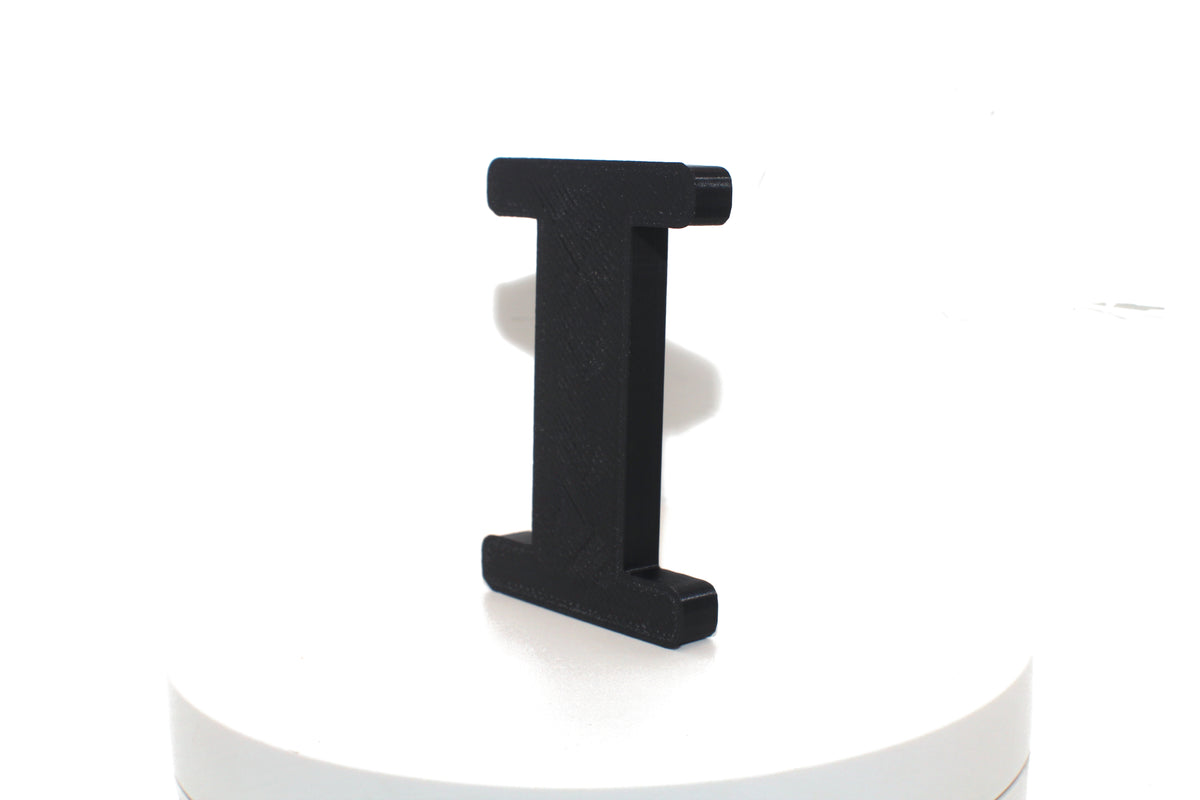 Black Eye large prop, matte black finish, angled view on a white platform.