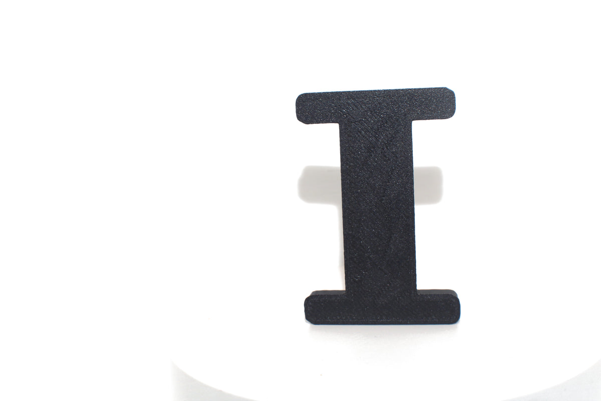 Black Eye large prop standing on a white pedestal, close-up detail.