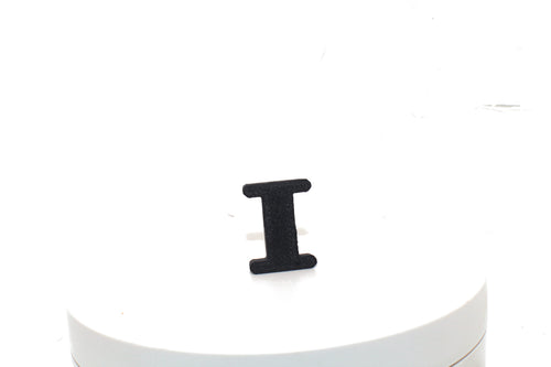 Black Eye small prop standing upright on a white display pedestal, front view.