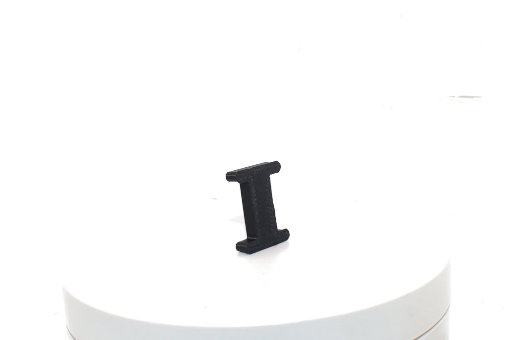 Black Eye small prop, rear three-quarter view on a white pedestal.