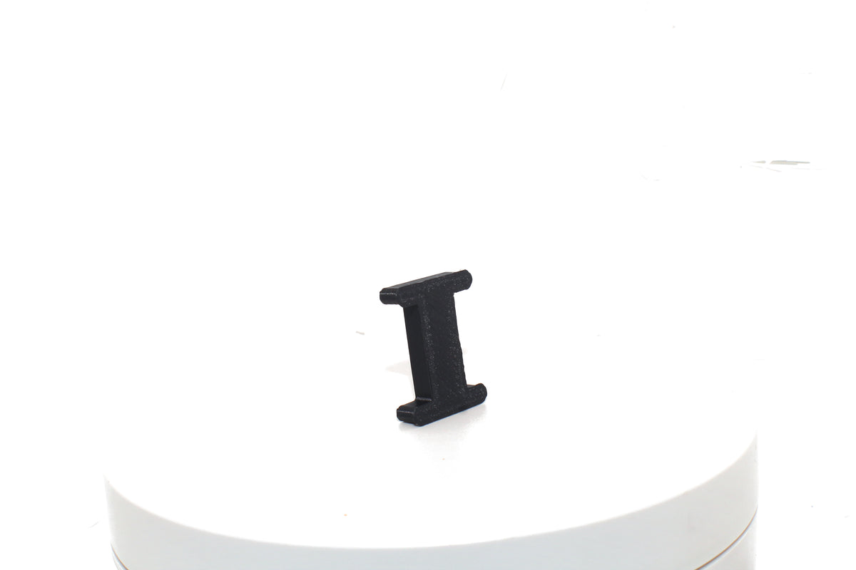 Black Eye small prop, rear three-quarter view on a white pedestal.