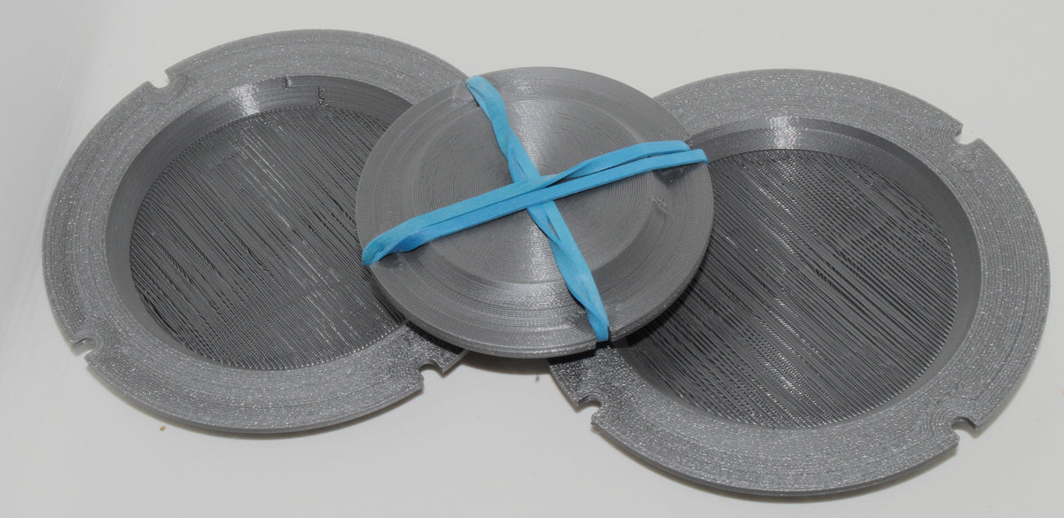 Jiffy Coin Trick parts laid out, gray 3D-printed pieces with a blue band.