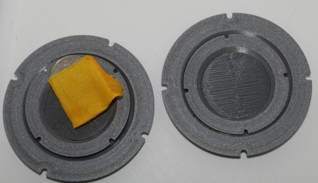 Jiffy Coin Trick components shown from above on a white background.