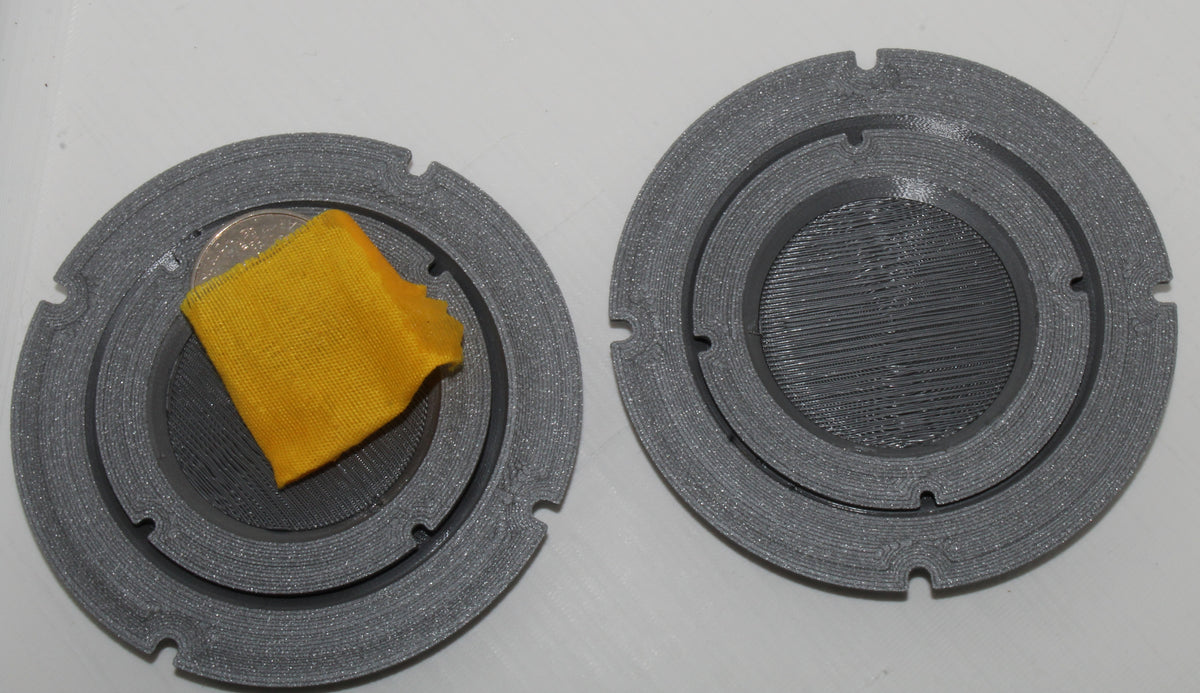 Jiffy Coin Trick components shown from above on a white background.