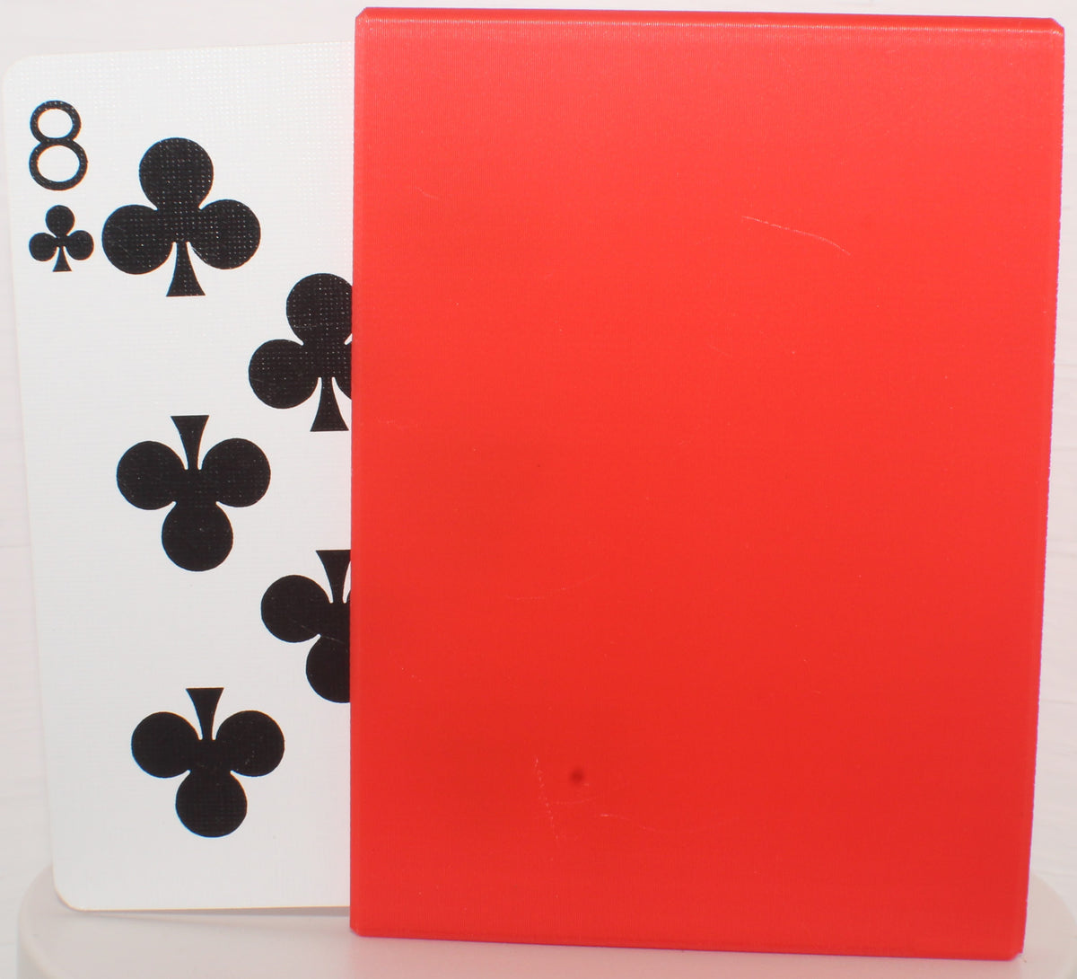 Q Family Card Packet Holder holding a card packet, eight of clubs visible.