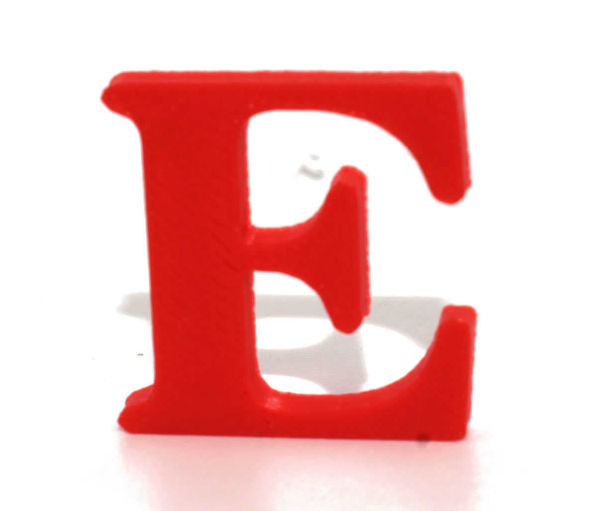 Red E small prop standing upright, three-quarter view.