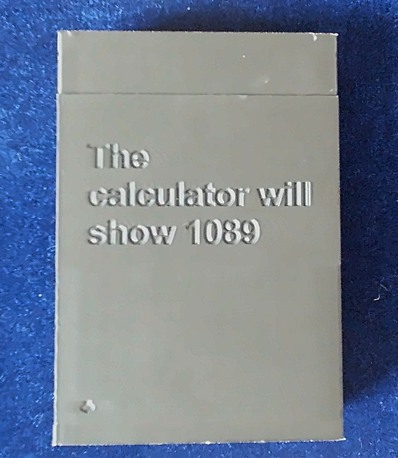 Ultimate Card Box back engraved 'The calculator will show 1089'