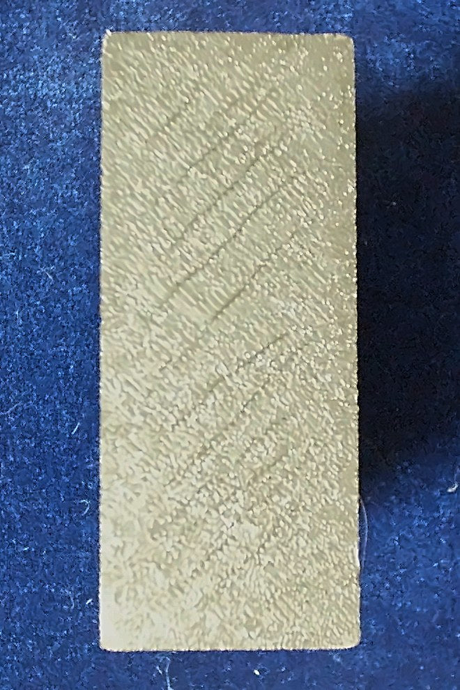 Plain textured end of the Ultimate Card Box where the '8 of spades' reveal is missing
