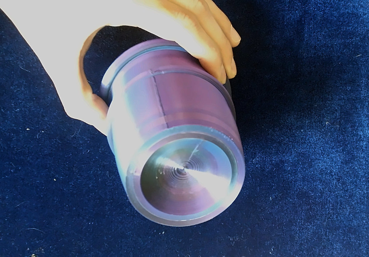 Base of a purple-teal Chop Cup with a visible seam line